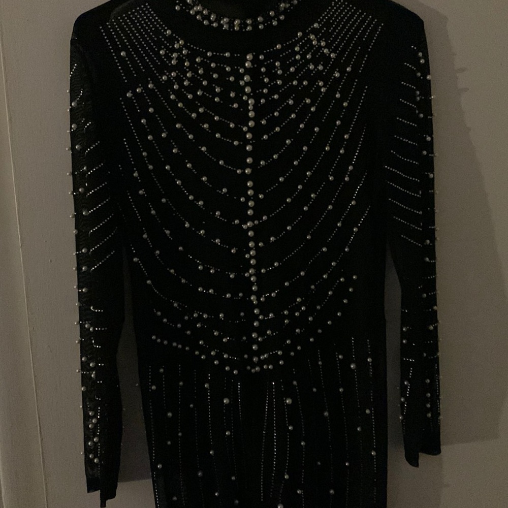 Beautiful jumpsuit with pearls see-through with diamonds